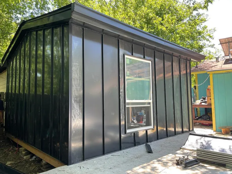 Black standing seam metal wall panels for Roof Inspection in Capitol View